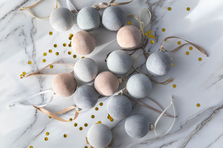 Christmas or New Year decorative background. Beautiful beige balls with a matte white coating