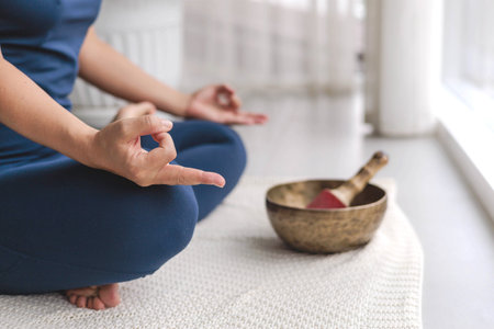 Unrecognizable yoga woman meditation in lotus position with mudra gyan gyana jnana hands closeupの写真素材