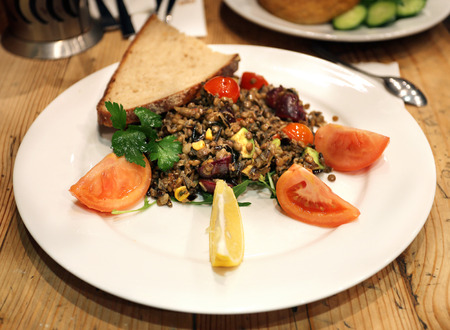 Lentils on a plate with vegetablesの写真素材