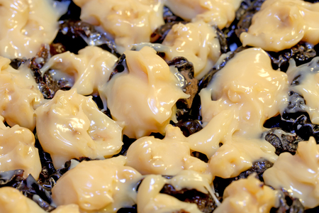 Delicious sweet fruit of plums with sugar and milk photographed close upの写真素材