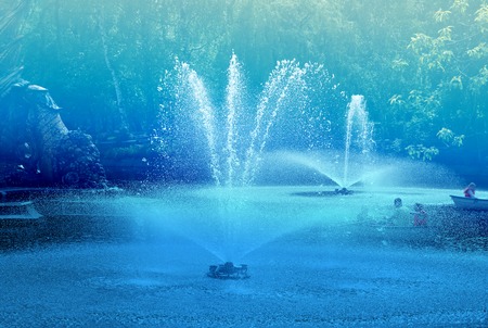 Beautiful ponds with fountainsの写真素材