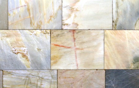 Photo background of the original beautiful colored marble wall with tiles
