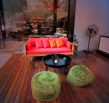 Beautiful interior with red sofa and green armchairsの写真素材