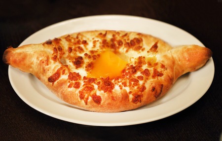Delicious Georgian Adjara khachapuri close up photosの写真素材