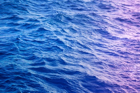 Photo background beautiful blue clean sea with wavesの写真素材