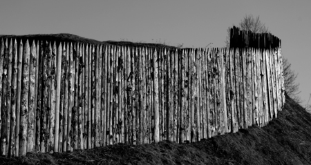 Photo background old wooden fences on the hills in the spring