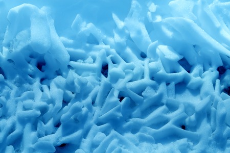 Photo of a bright macro snow texture on the roadの写真素材