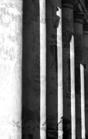 The columns of the building photographed in close-up black and white photography
