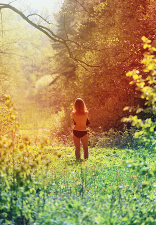 Beautiful woman standing with her back photographed in close-upの写真素材