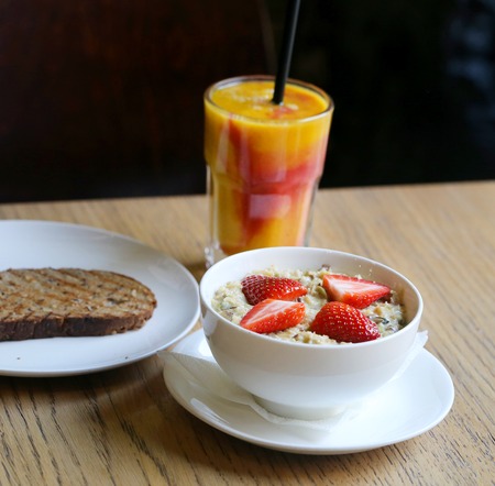 Beautiful photo of delicious fruit juice in a glass with a strawの写真素材