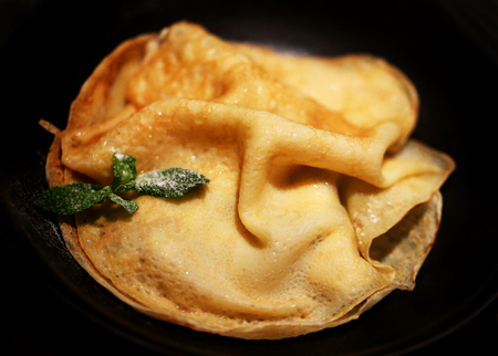 Big delicious pancake on a black backgroundの写真素材