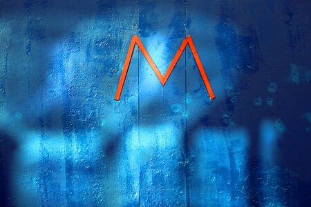 Beautiful blue texture of the boards with the letter m photographedの写真素材