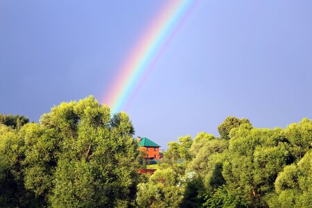 Beautiful colorful rainbow in the blue skyの写真素材