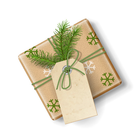 Wrapped vintage Christmas vector gift box with fir tree branch, isolated on white. Top view on Xmas gift with blank labelのイラスト素材