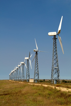The wind generators against the blue sky