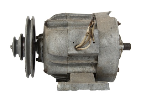 Old electric motor with a pulley, isolated on white backgroundの写真素材