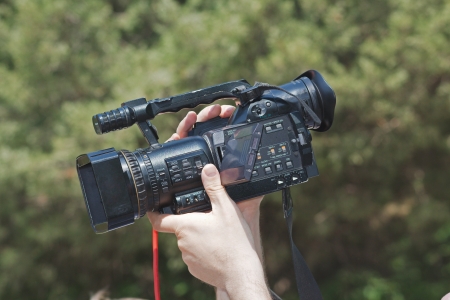Operator holding a TV cameraのeditorial素材