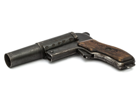 Old signal pistol, flare gun, isolated on white backgroundの写真素材