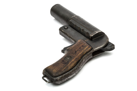 Old signal pistol, flare gun, isolated on white background