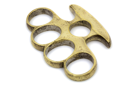 Brass knuckle-duster, weapon for hand, isolated on white backgroundの写真素材