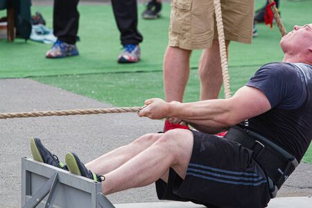 Athlete pulls the truck by the rope, 2nd Championship of Ukraine in power extreme. Date May 27, 2017, Melitopol, Ukraineのeditorial素材