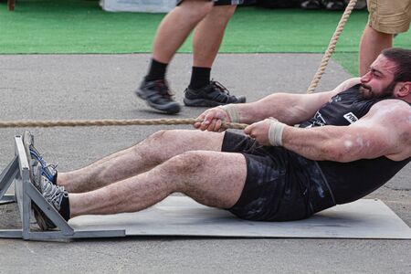 Athlete pulls the truck by the rope, 2nd Championship of Ukraine in power extreme. Date May 27, 2017, Melitopol, Ukraineのeditorial素材