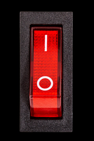Red power switch at ON position, isolated on black background