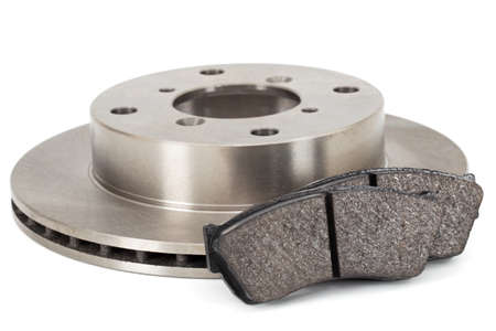 Ventilated car brake disc and pads, isolated on white background, isolated on white backgroundの写真素材