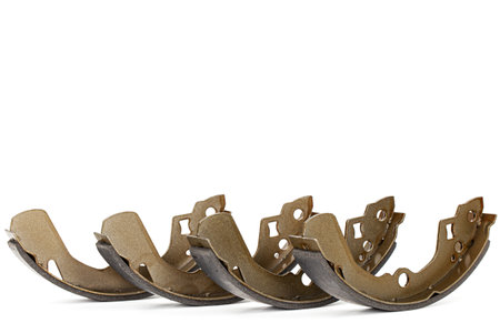 Set of asbestos brake pads, replacement spare parts of the car brake system, isolated on white backgroundの写真素材