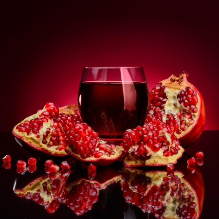 red pomegranate fruits on a dark backgroundの写真素材