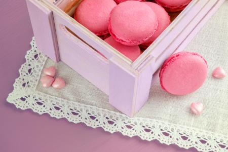 pink macarons in box and little hearts. Selective focusの写真素材