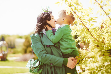 happy  family; young mother and her son spending time outdoor on a summer dayの写真素材