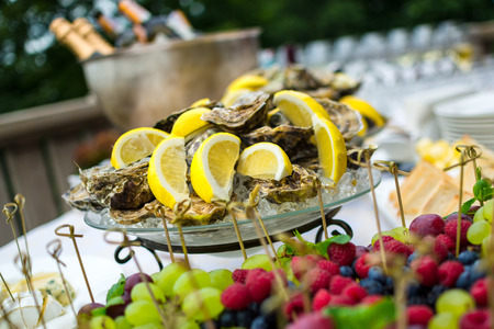 Oysters on ice at buffet table, cateringの写真素材