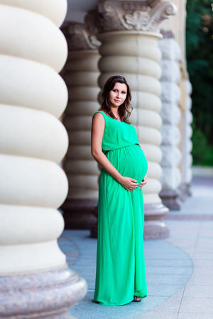 Beautiful pregnant woman feeling lovelyの写真素材