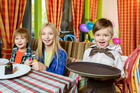 Visitors and the waiters at the restaurant or cafe.の写真素材