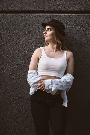 fashion portrait of young stylish beautiful woman in a urban backgroundの写真素材