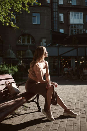 fashion portrait of young stylish beautiful woman in a urban backgroundの写真素材