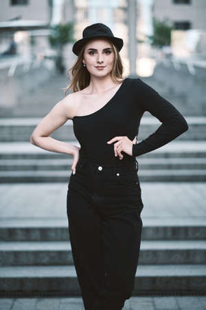 fashion portrait of young stylish beautiful woman in a urban background