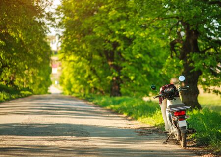 Motorcycle bike on an empty country road, freedom of travel, active lifestyleの写真素材