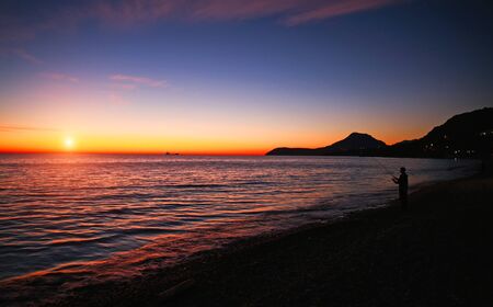 Spectacular romantic sunset on the Mediterranean coast, clouds in the colorful sky, Bar, Montenegroの写真素材
