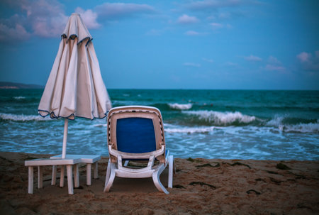 Empty sandy sea beach with sun loungers on the background of a colorful dramatic sky, Europe, Bulgariaの写真素材