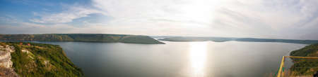 Beautiful landscape over the river on the background of a magnificent sky, panorama of Bakota bay, nature in Ukraineの写真素材
