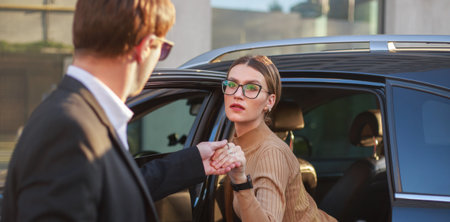 Corporate meeting of two employees in a car for work and discussion of businessの写真素材