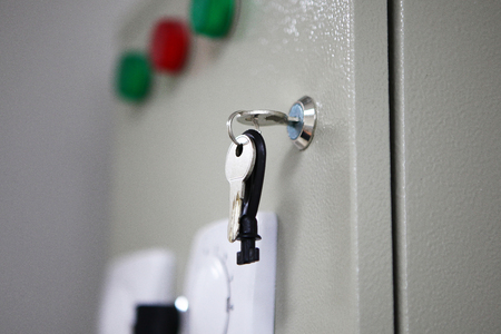 The keys in the keyhole on the box with medical equipment. Macro photo and out of focus background.の写真素材