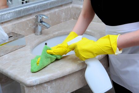 Cleaning in the bathroom. Disinfection of premises. Copy space. Unrecognizable photo.の写真素材