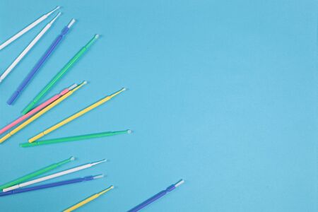 Dental instruments on a blue background. Top view. Copy space.