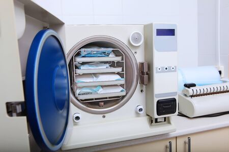 Cabinet for sterilization of dental instruments in the clinic. Photos in the interior without people. Copy space.の写真素材