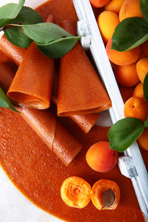 Apricots and fruit pastille on a white background. Natural and dietary product. Without...