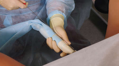 Manipulations of a doctor during artificial insemination. Reproductive technologies. The problem of getting pregnant.Close-up of the IVF procedure.の写真素材