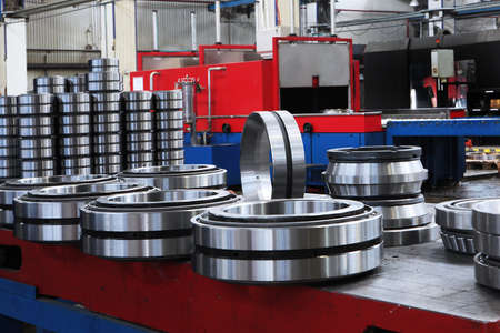 A large number of ready-made bearings in the factory. Finished products of the bearing plant. Heavy industry concept. Metal products.の写真素材